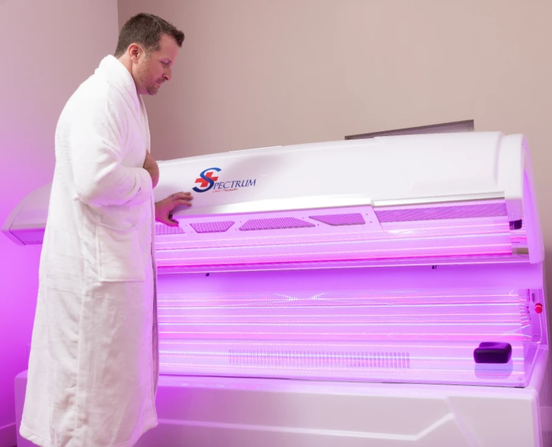 Man using light therapy bed
