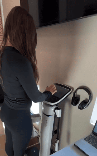 Person using machine for body composition analysis